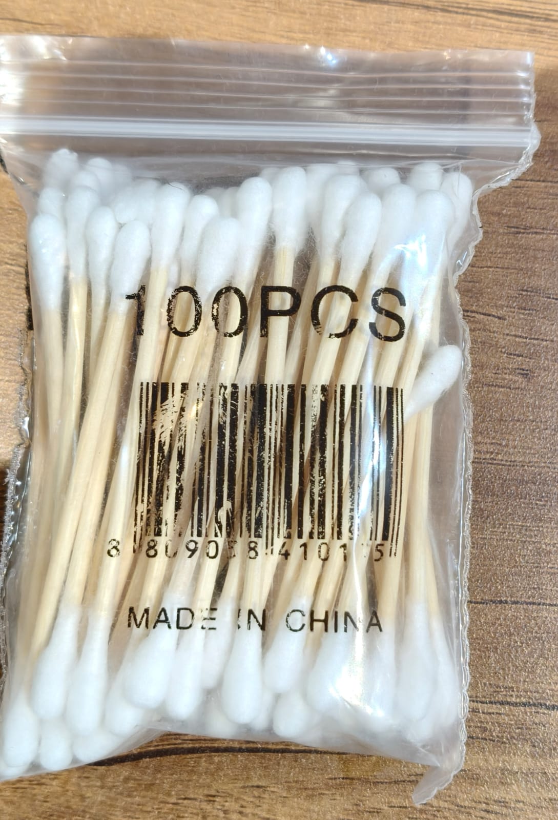 Eco-friendly cotton swabs packaging highlighting biodegradable wooden stems