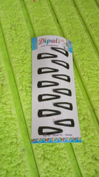 Close-up of the metal construction and smooth finish of the Tic Tac hair clips.