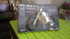 Kids enjoying the challenge of assembling the metal bike building blocks.