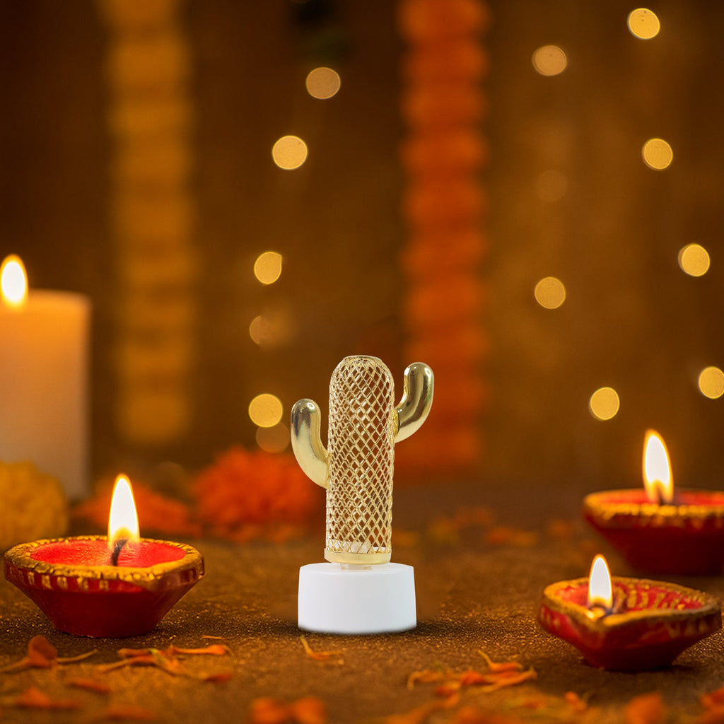 Single cactus shaped flameless LED candle detail with golden pattern