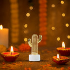 Single cactus shaped flameless LED candle detail with golden pattern