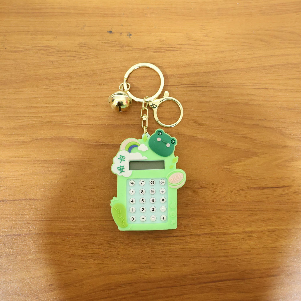 Frog calculator keychain displayed attached to a bag as a cute charm