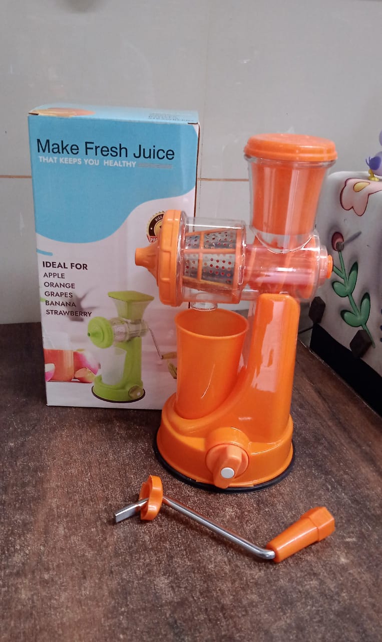 Packaging of the Quickslice Manual Fruit Juicer with all included accessories.