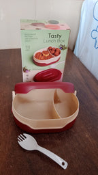 Compact airtight tiffin box with spoon, ideal for travel.