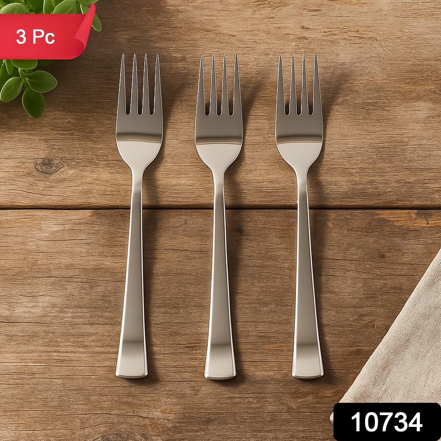 Set of three polished stainless steel dinner forks on a clean surface.
