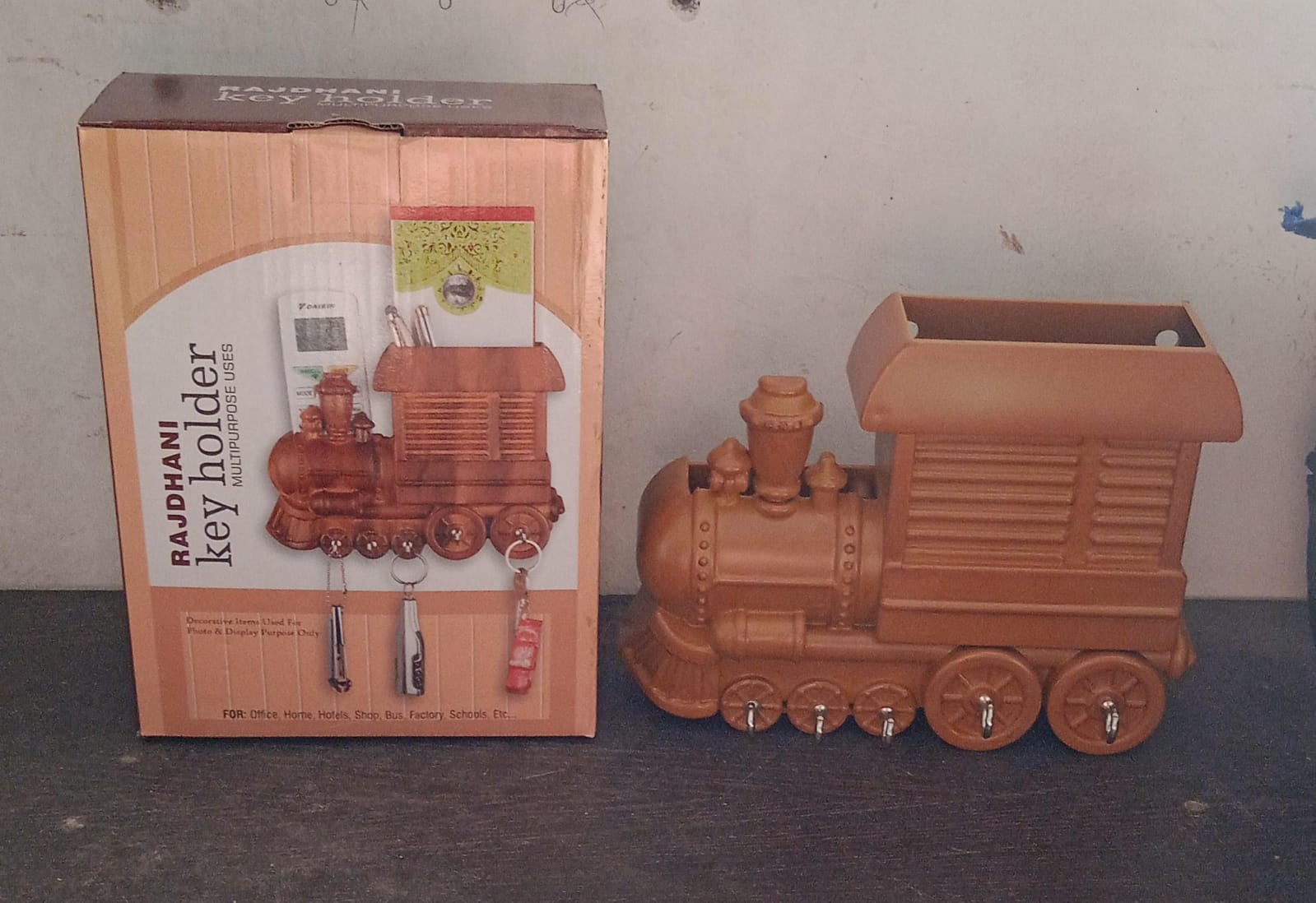 Detailed shot of the plastic train engine design key holder.