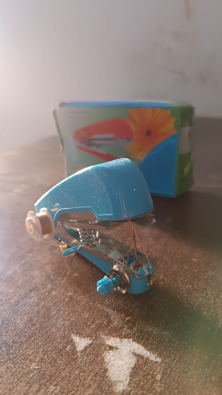 Top-down view of the portable mini sewing machine, showing its compact size.