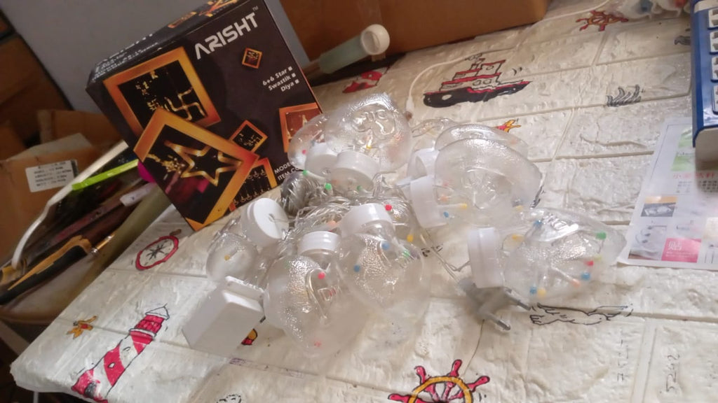 Wish Ball LED string lights glowing in the dark, perfect for festival lighting.