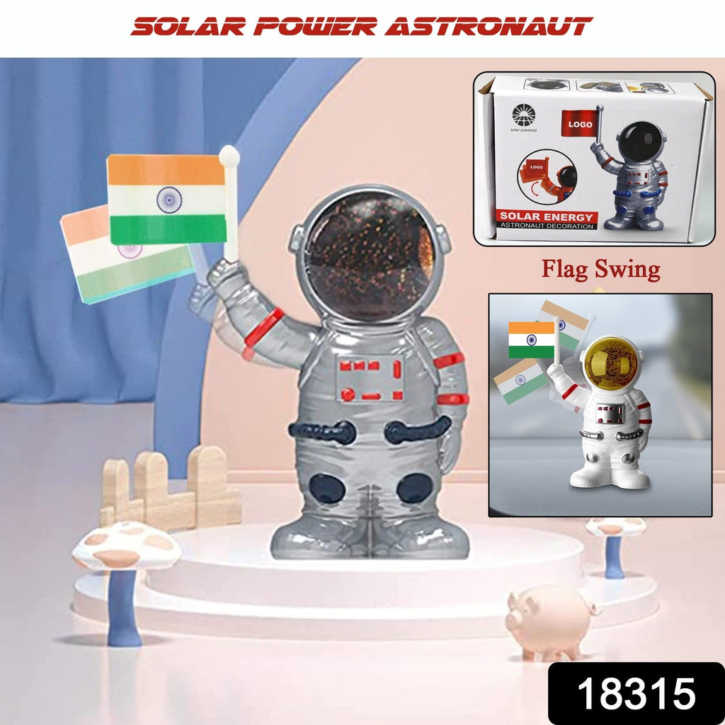 Close-up of solar astronaut ornament moving hand featuring Indian flag for car decoration