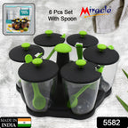 Top-down view of the revolving spice rack, showcasing its sleek design and six clear jars.