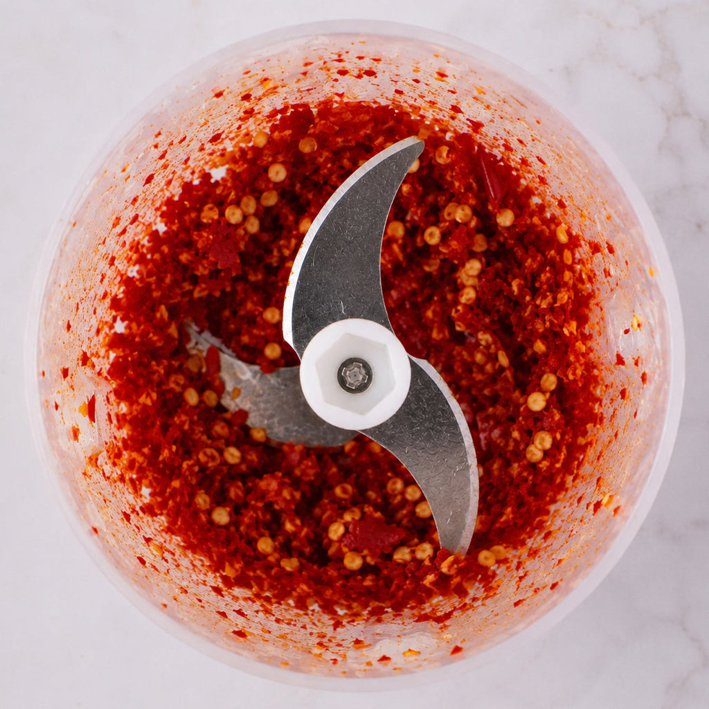 Chili inside stainless steel blade of garlic chopper