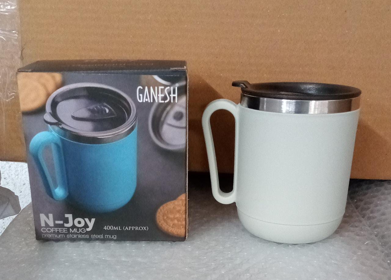 The Ganesh brand logo prominently displayed on the premium stainless steel coffee mug.