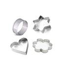 Four stainless steel cookie cutters in heart, star, round, and flower shapes on a white surface.