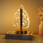 Golden crystal leaf LED lamp front view showing metallic base and crystal shade