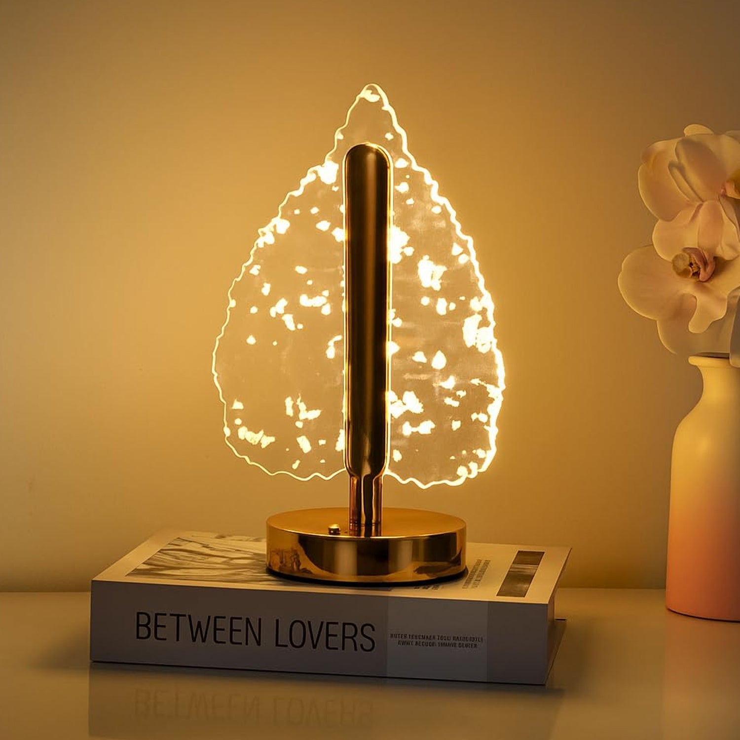 Golden crystal leaf LED lamp front view showing metallic base and crystal shade