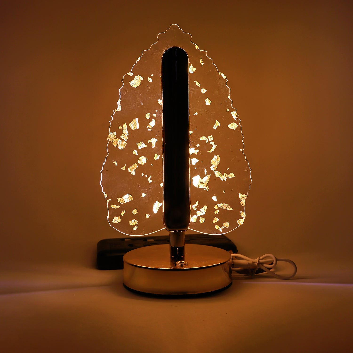Stand-alone image of golden crystal leaf-shaped LED table lamp