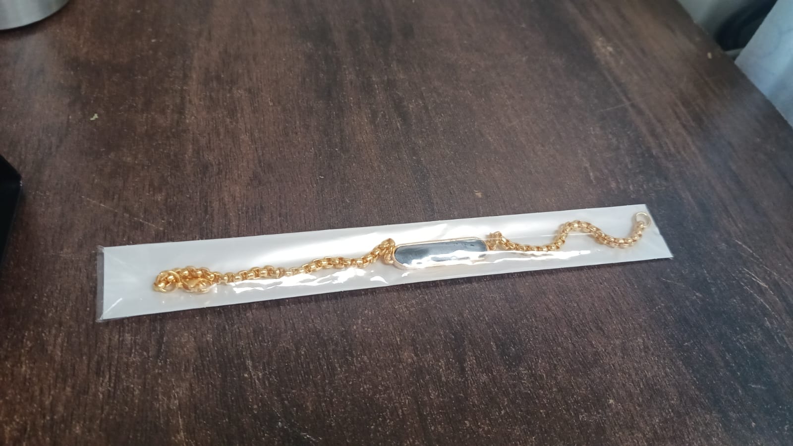 Elegant golden bracelet, ready for personalization.