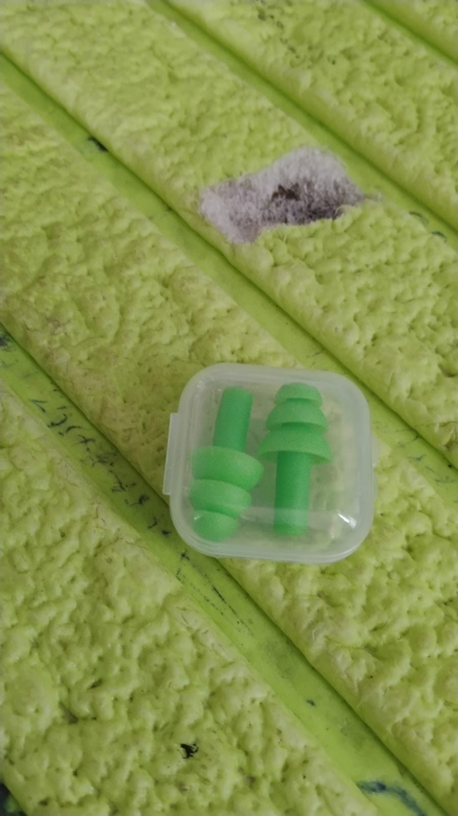 Packaging for the 2-piece set of XcelSafe foam ear plugs, emphasizing portability and ease of storage.