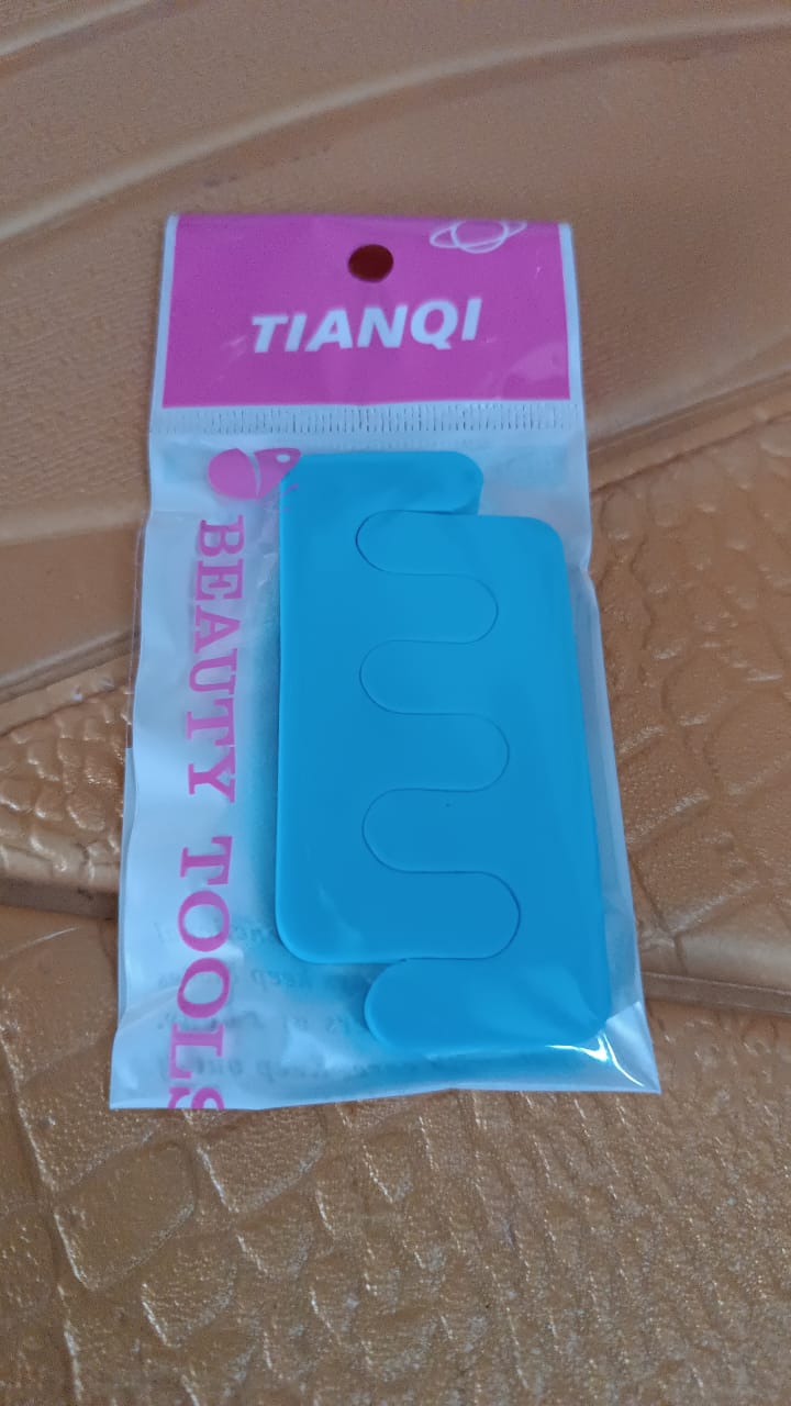 Close up of sponge toe separator used for comfortable toe alignment during pedicure
