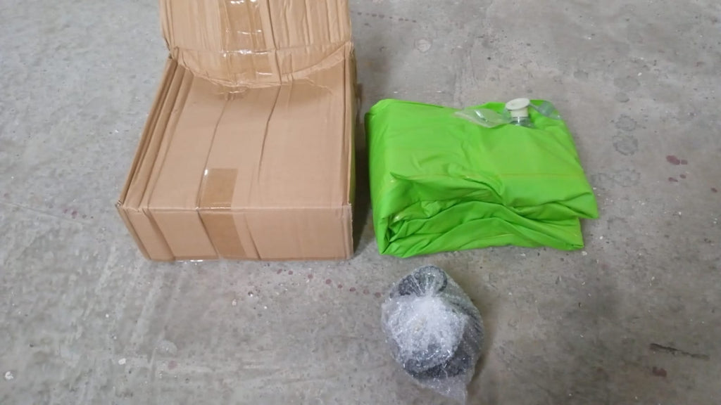 Portable inflatable car bed kit with pump and pillows displayed for travelers.