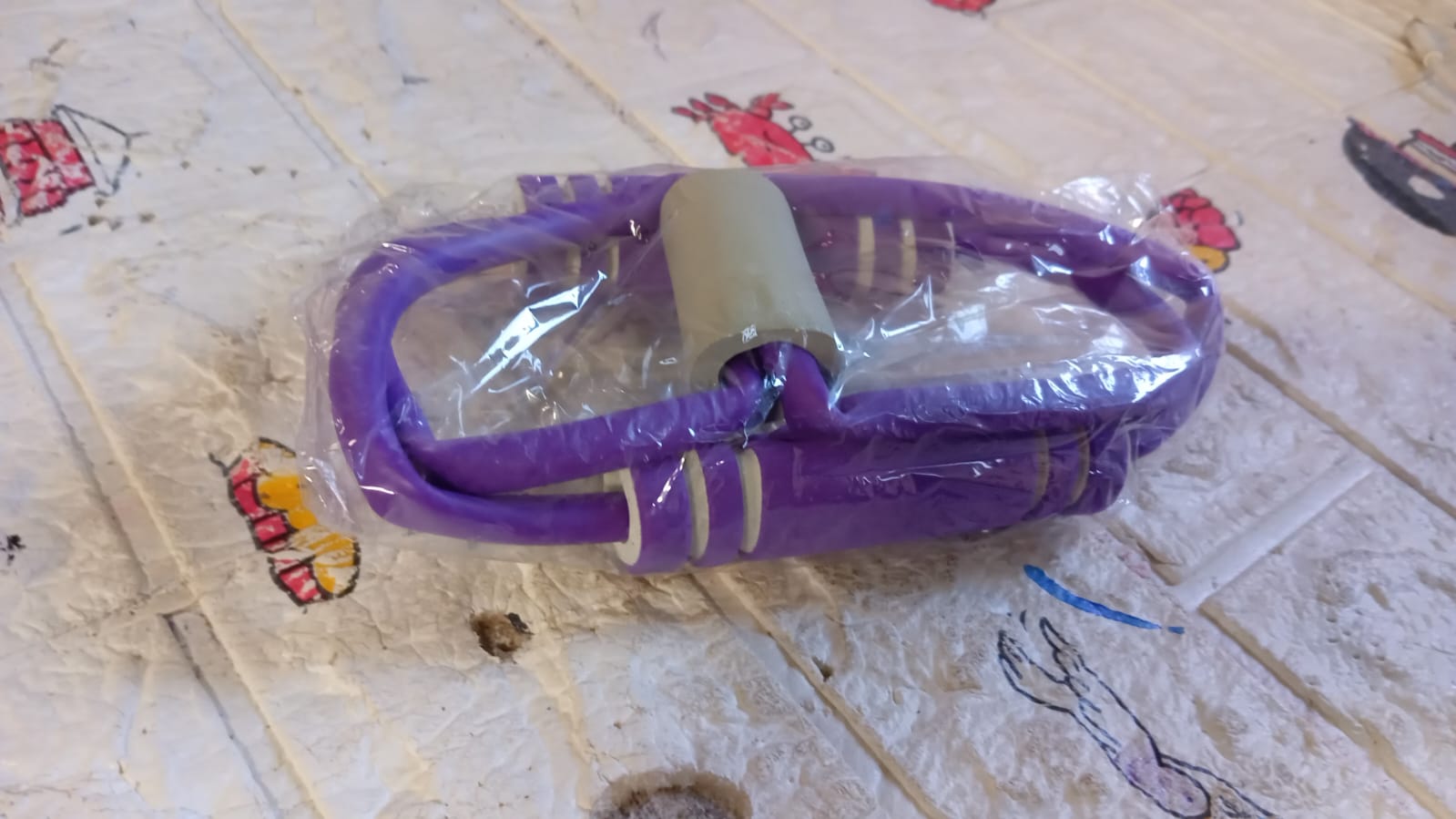 Versatile resistance loop band displayed, perfect for yoga and fitness enthusiasts.