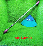 The extendable handle of the cobweb cleaner fully extended for high ceiling cleaning.