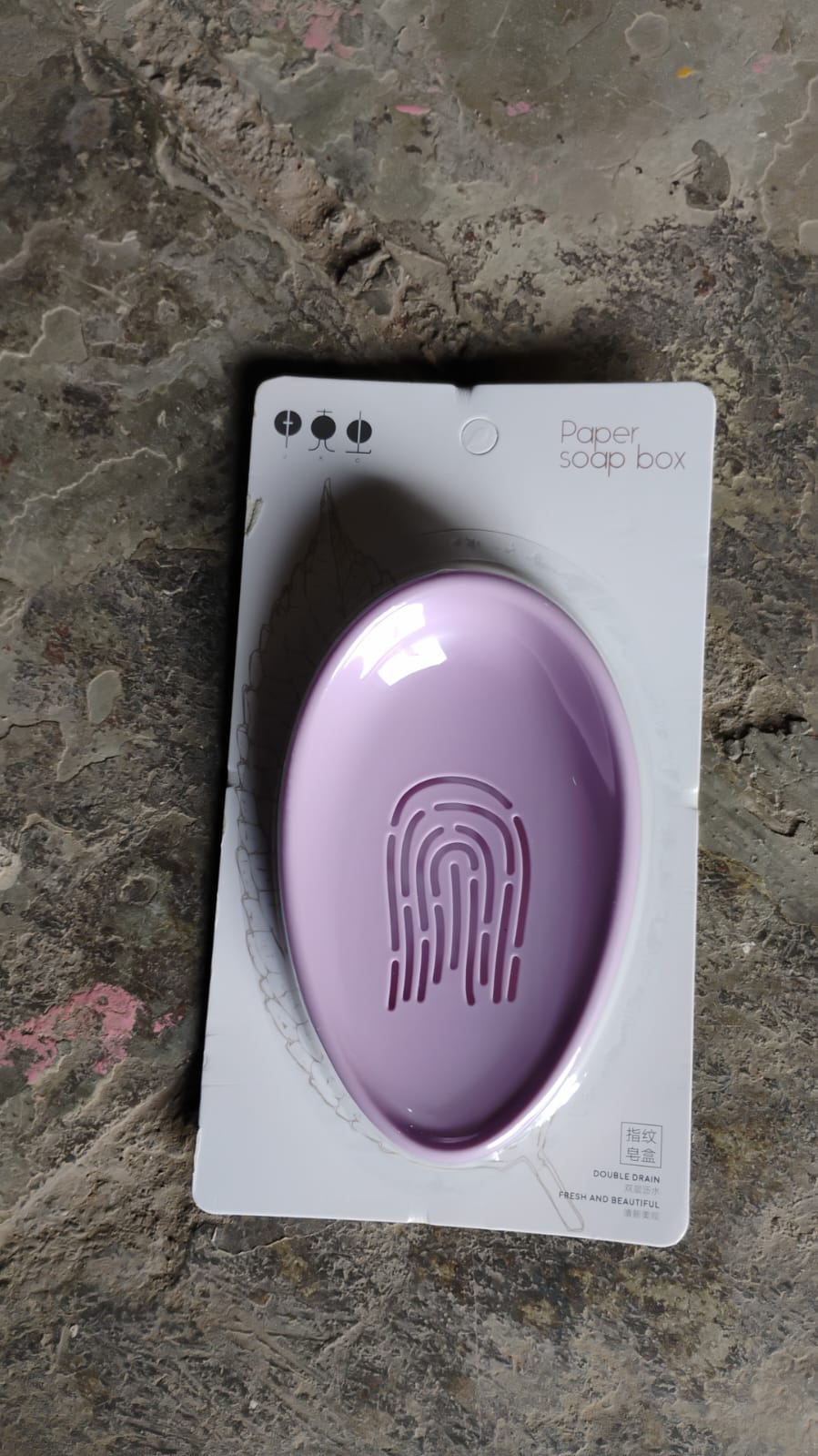 Top-down view of the compact plastic soap dish, highlighting its clean lines and functionality.