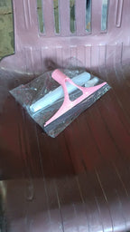 Close-up of the efficient cleaning brush head with integrated squeegee blade.