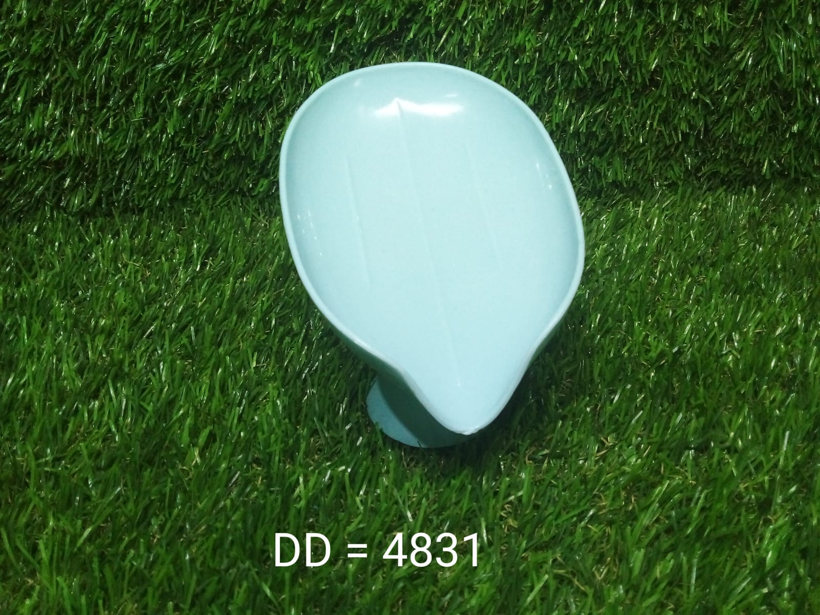 Lifestyle shot of the leaf-shaped soap dish, keeping a bar of soap perfectly dry and clean.