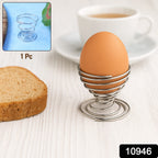 Close-up of stainless steel spring egg holder holding a soft-boiled egg