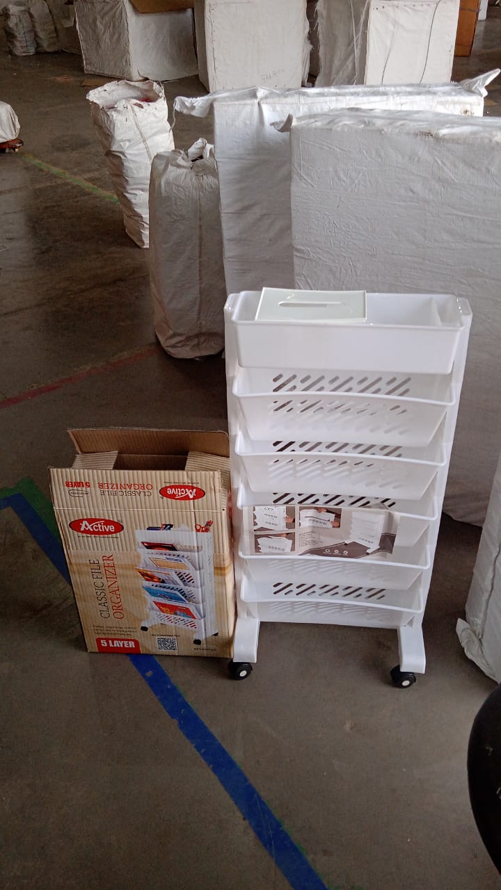 Space-saving movable plastic bookshelf fitting under table or desk