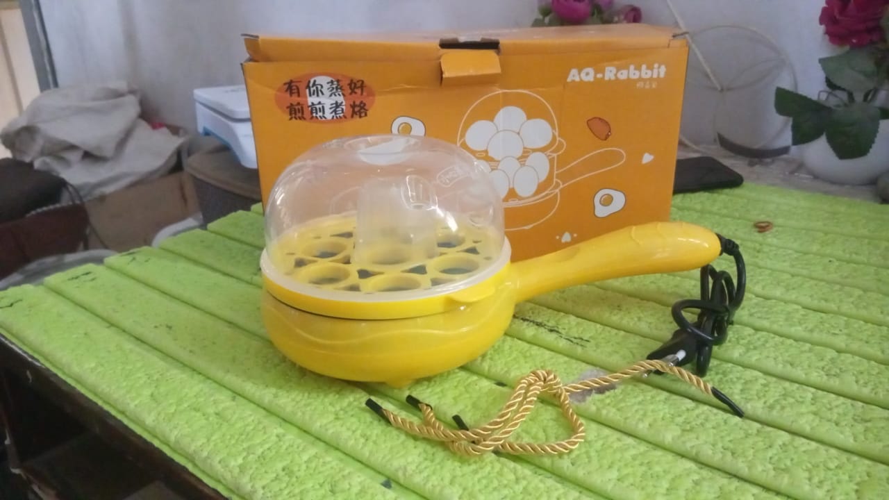 The complete Siplix Electric Egg Boiler Frying Pan set with all accessories laid out.