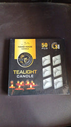 Overhead view of multiple tealight candles in a box.