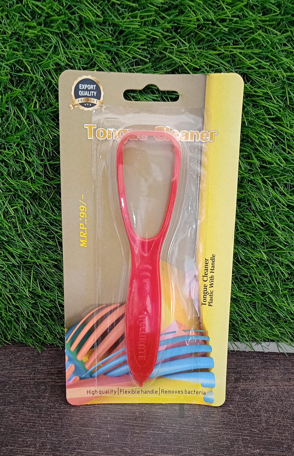 Angled product view of the MintGuard plastic tongue cleaner on a clean surface.