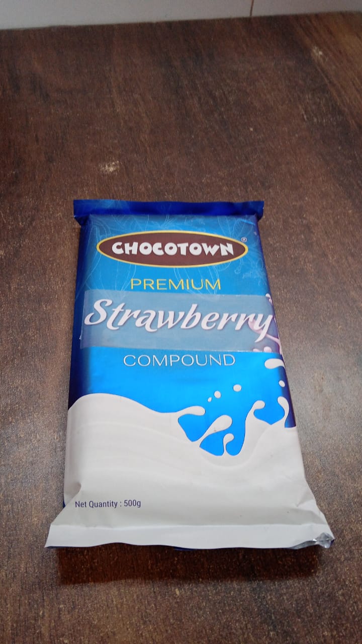 Ingredients list and nutritional information on the strawberry compound packaging.
