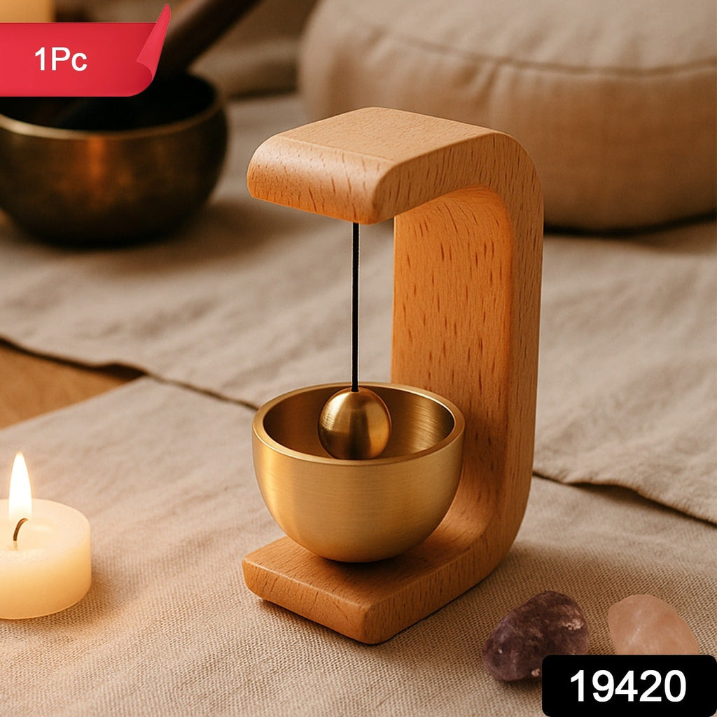 Japanese style Zen bell resting on polished wooden stand for meditation