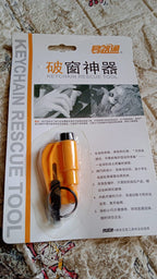 Emergency Safety Cutter keychain shown next to car keys for scale and portability.