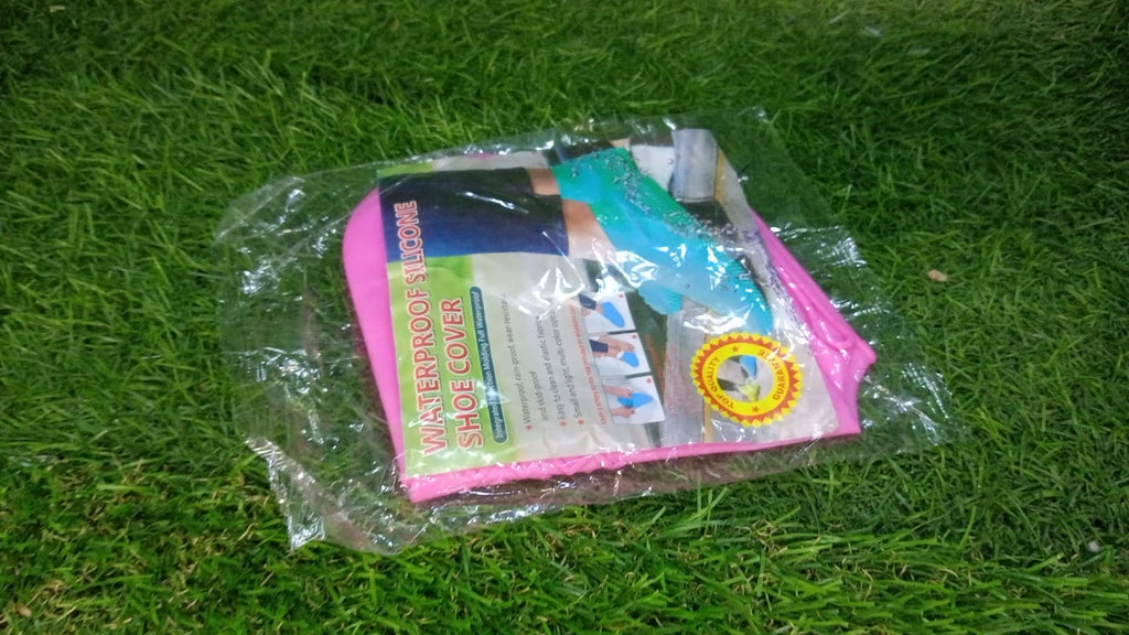 Waterproof silicone shoe covers displayed with a puddle, illustrating their rain protection.