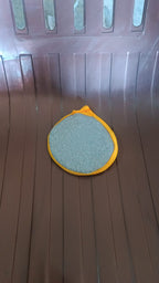 Dishwashing sponge brush placed in kitchen setting ready for use