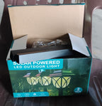 A set of FitFuzion solar pathway lights packaged in their retail box, ready for installation.