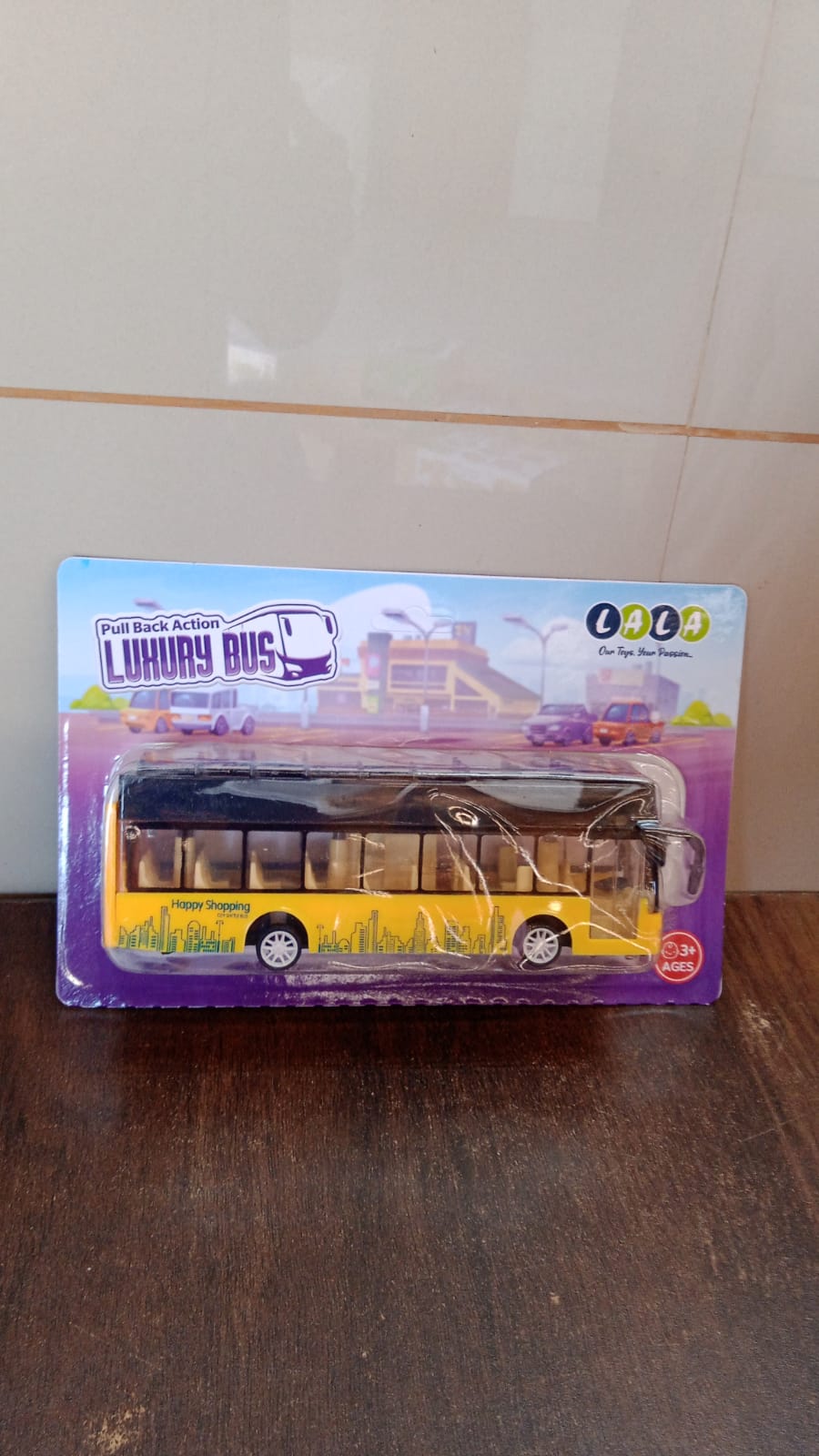 Rear view of die-cast London double decker sightseeing bus toy showing pull-back wheels
