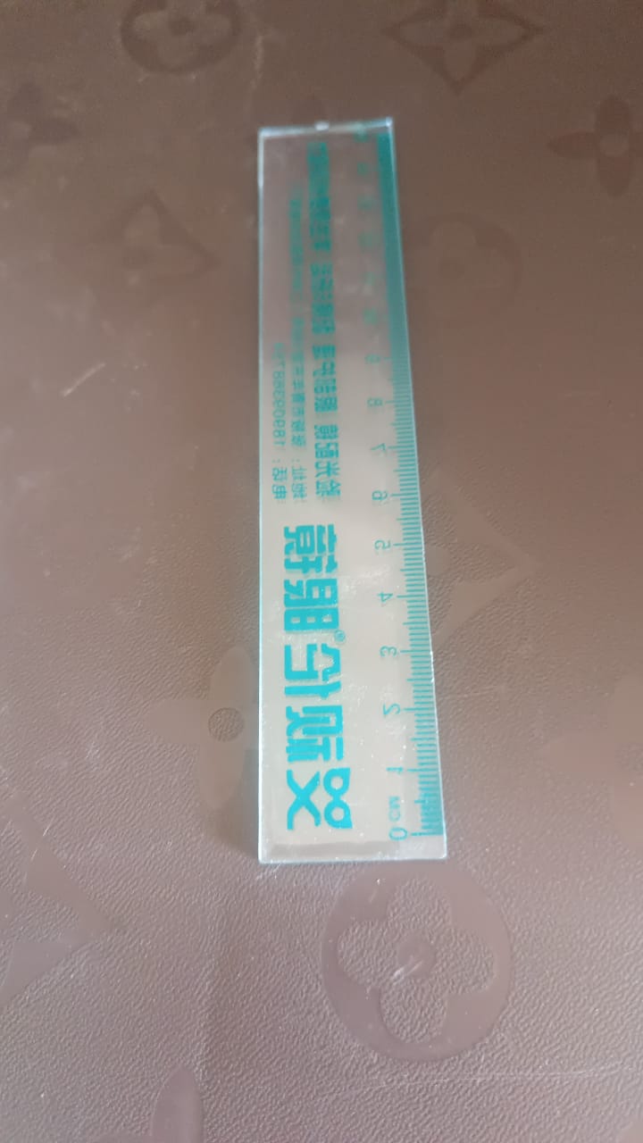 Packaging for transparent 15cm plastic scale with green text