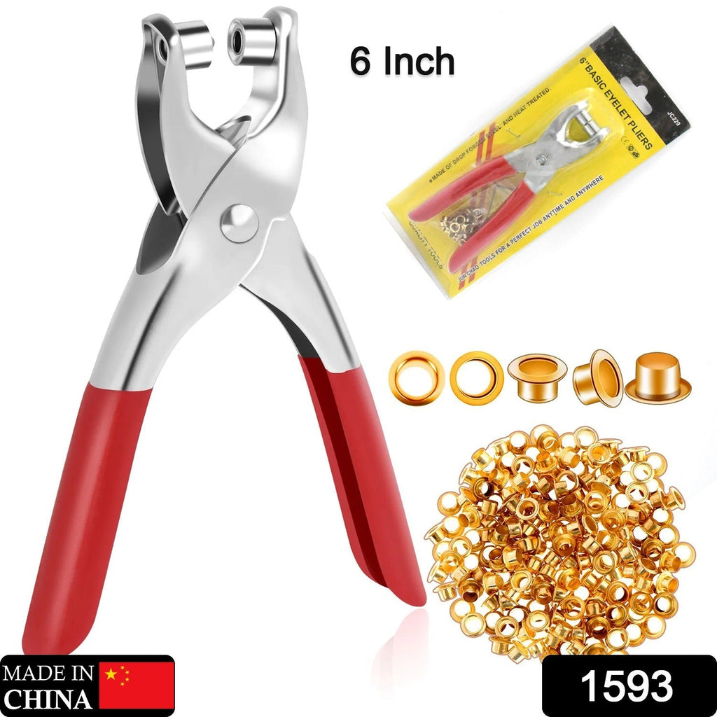 Close-up of the robust grommet tool pliers and shiny gold eyelets, ready for use.