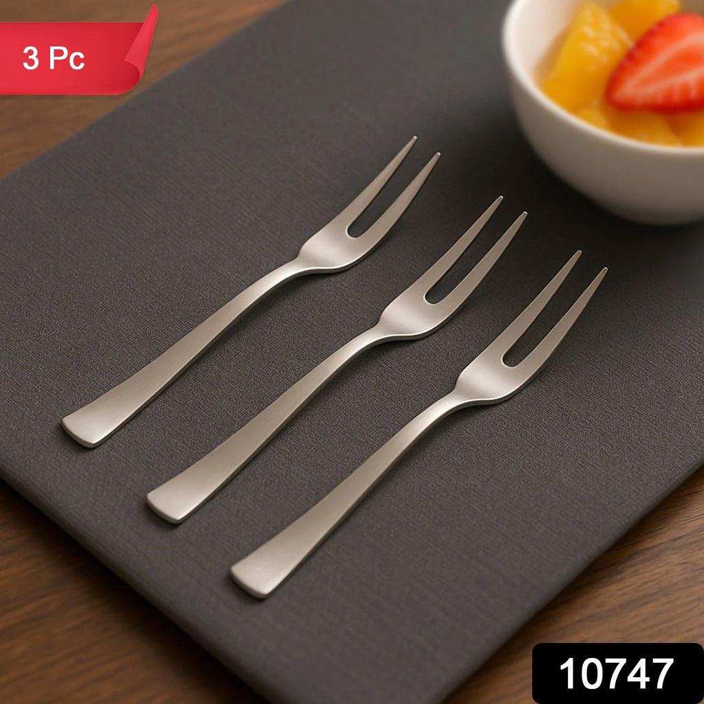 Three mini dessert forks arranged together for serving