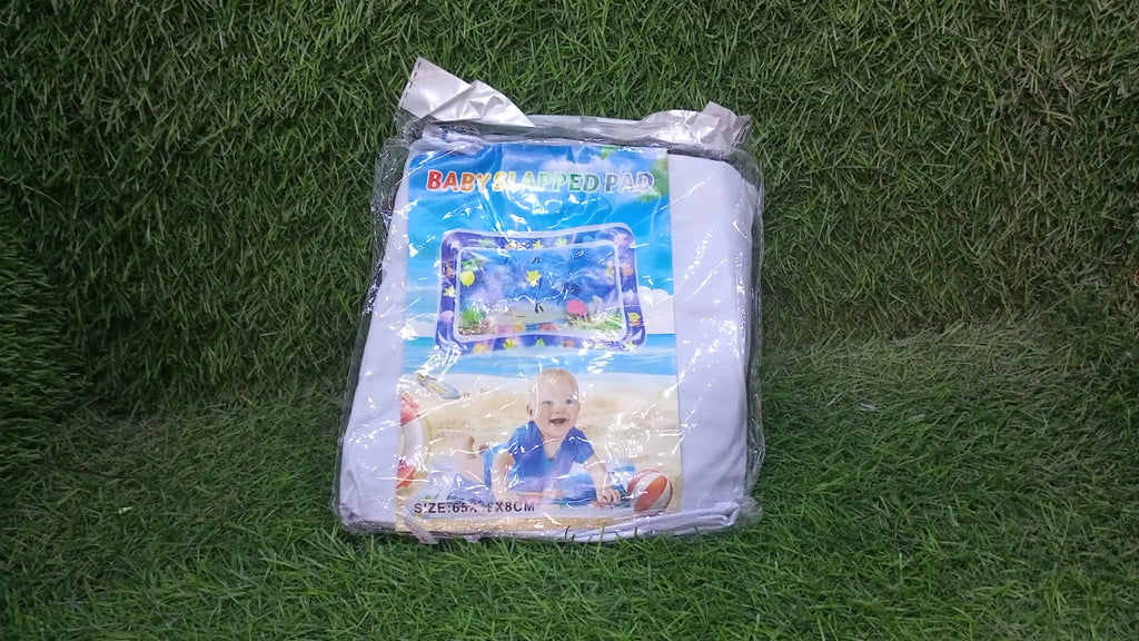 Portable and deflated Baby Water Mat, showcasing its compact storage for travel.