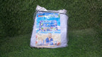 Portable and deflated Baby Water Mat, showcasing its compact storage for travel.