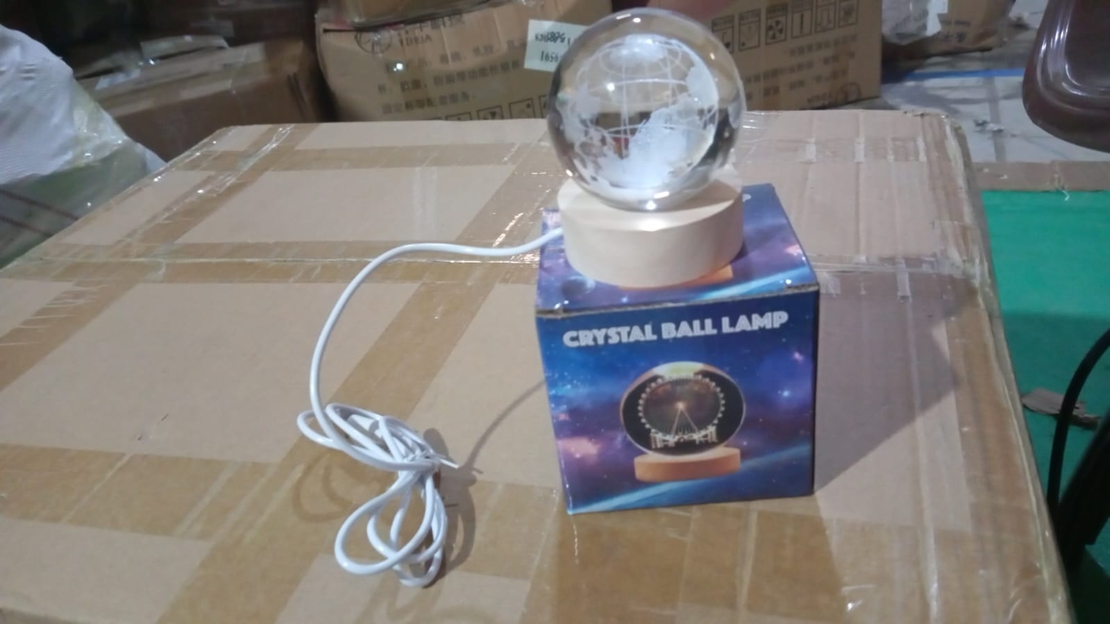 Lifestyle shot of the 3D crystal ball lamp enhancing a bedroom's ambiance.