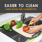 Foldable dish drying rack for sink, neatly rolled up for compact storage.