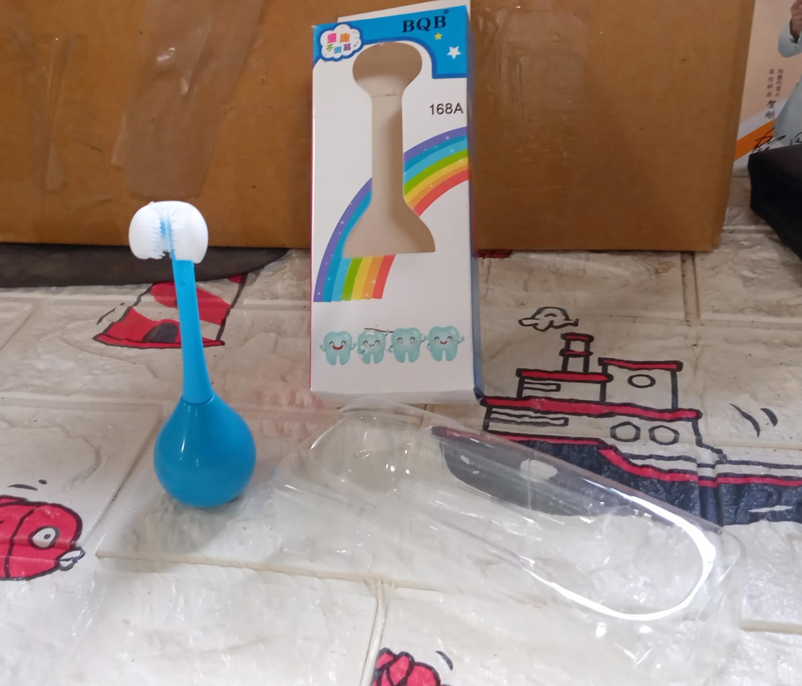 Packaging of the MintGuard Kids 3-Sided Toothbrush, ready for gifting.