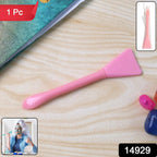Angled view of flexible facial mask applicator spatula